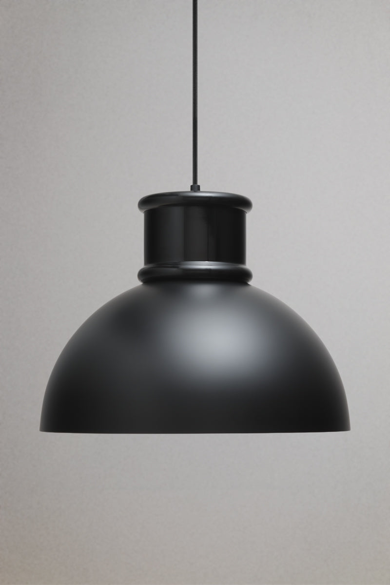 Matt black industrial dome pendant light with smooth metal shade shown unlit on a neutral background.
