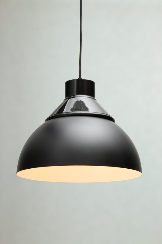 Dome Foundry Pendant Light in black with industrial metal dome shade and warm white interior