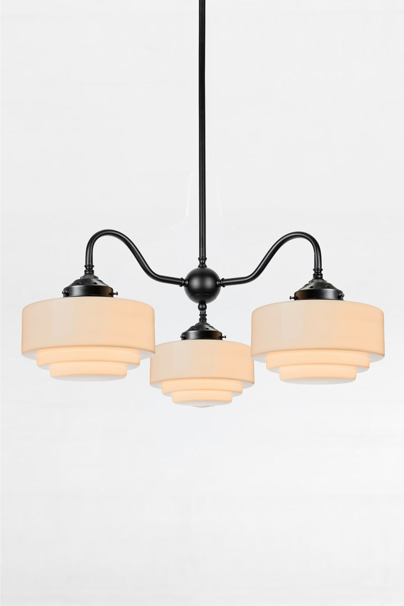 Regis Glass Deco Gooseneck Chandelier in black finish with handcrafted opal glass shades against light studio background