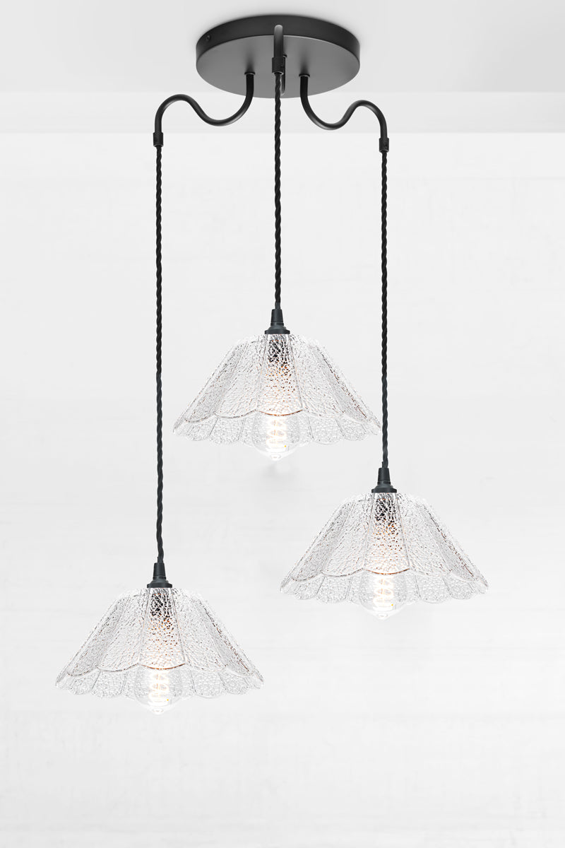 3 light multi light with gooseneck arms and a crackle glass shades with black twist cords. 