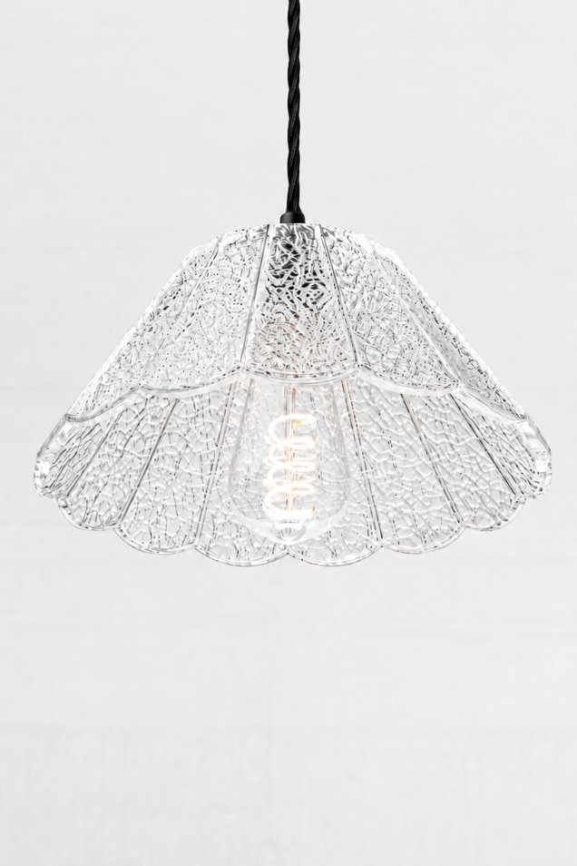 Clear glass shade with a crackle detailing, paired with black twisted cord. 