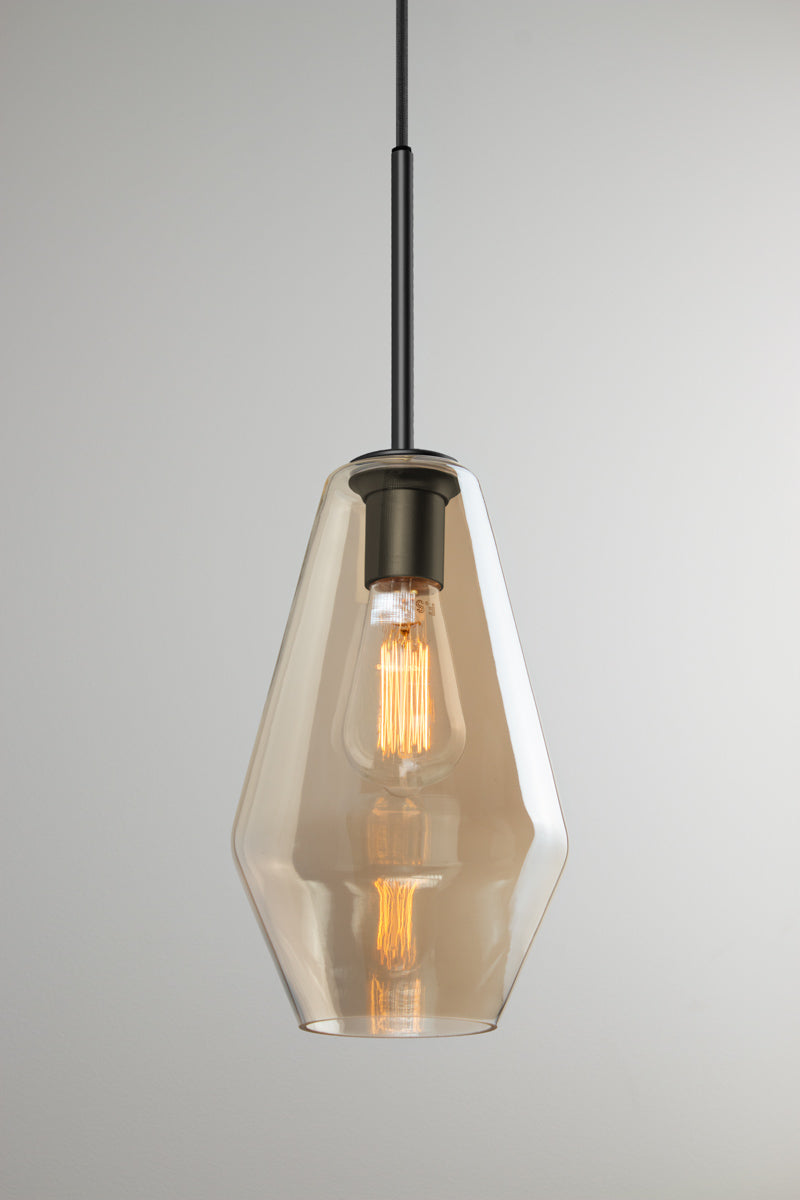 Lugano champagne glass pendant shade C with elongated faceted silhouette, black lampholder and exposed bulb.