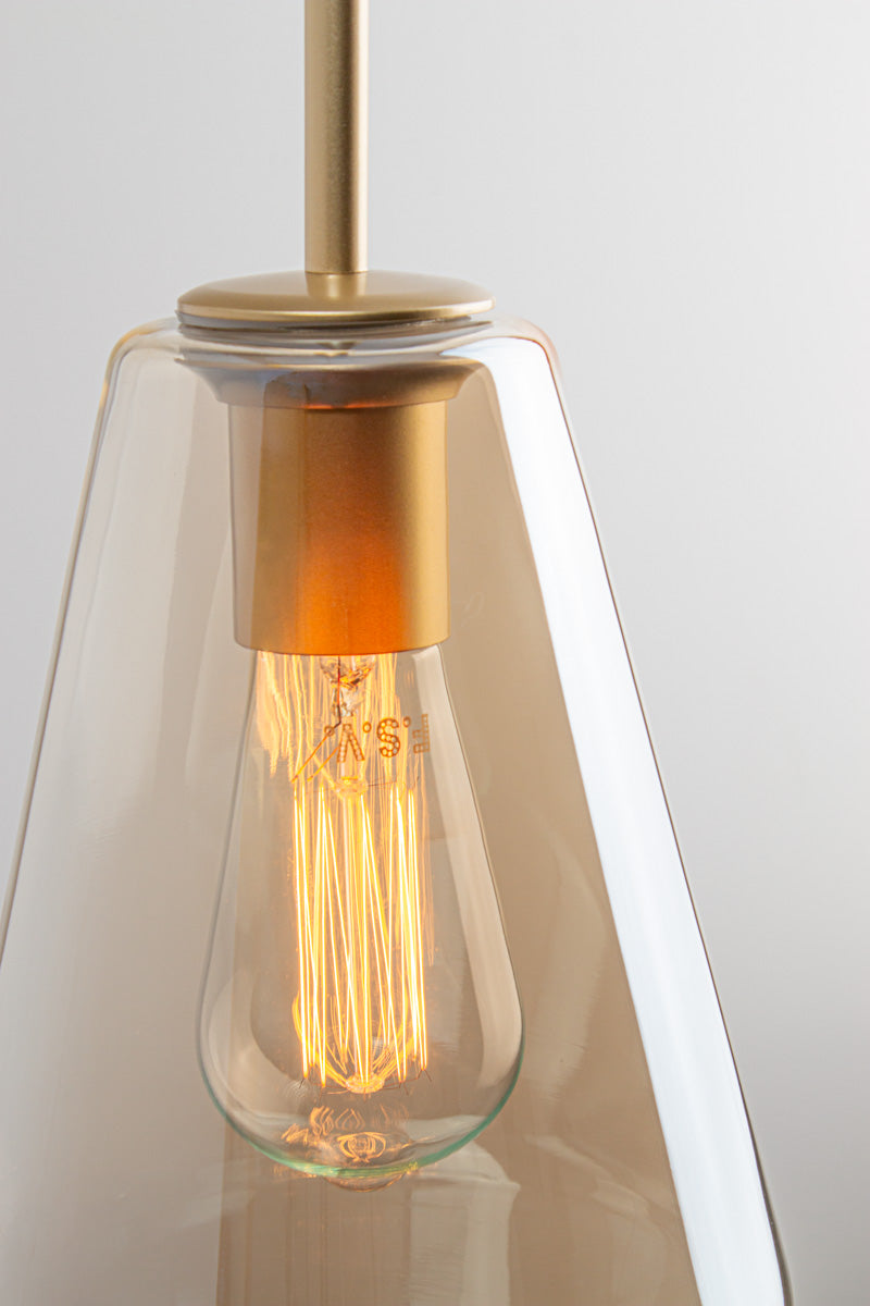 Close-up of Lugano Glass Pendant Light shade C in champagne glass with gold brass fitting and exposed bulb