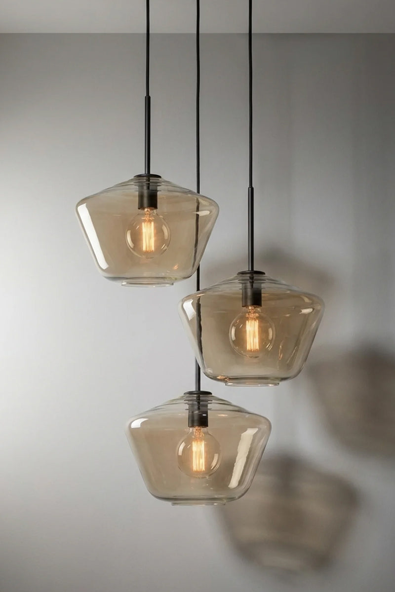Lugano Glass Multi Drop Pendant – Shade A three drop pendant with black cloth cords and Champagne glass shades