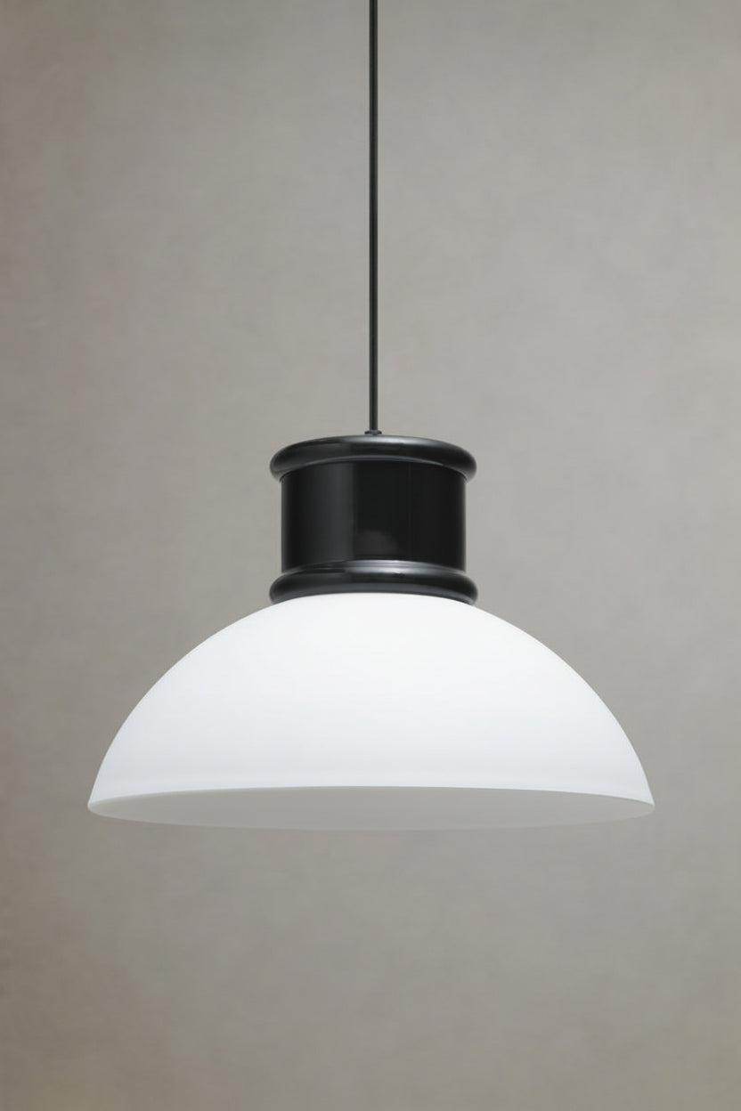 Side view of the Homestead Brickworks Pendant Light featuring a white dome shade with black metal shade cover
