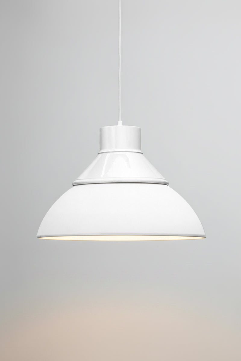 Homestead Foundry Pendant Light  unilluminated with a white shade cover and opal glass dome shade. 