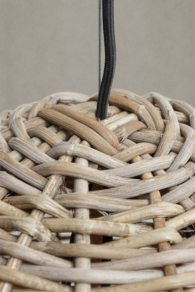 Close up of the wird and fabric cord suspension of the bell shape rattan pendant light.