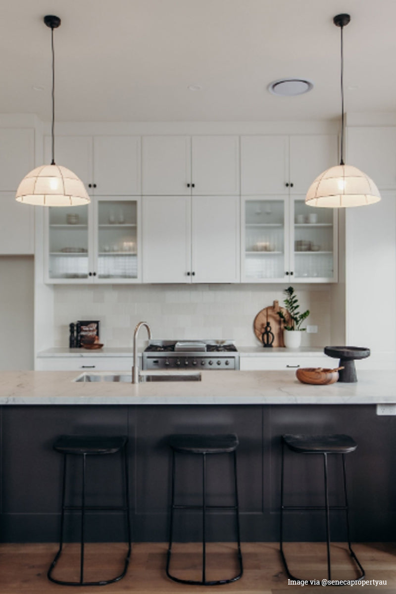 Image via @senecapropertyau: Two fabric pendants in a fresh kitchen space. 