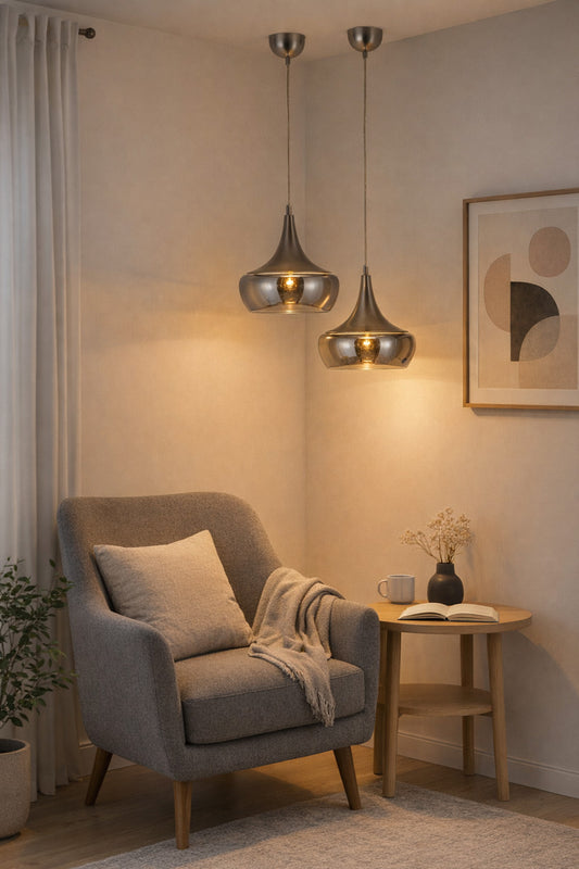 Two glass and metal pendants as a feature over a reading nook. 
