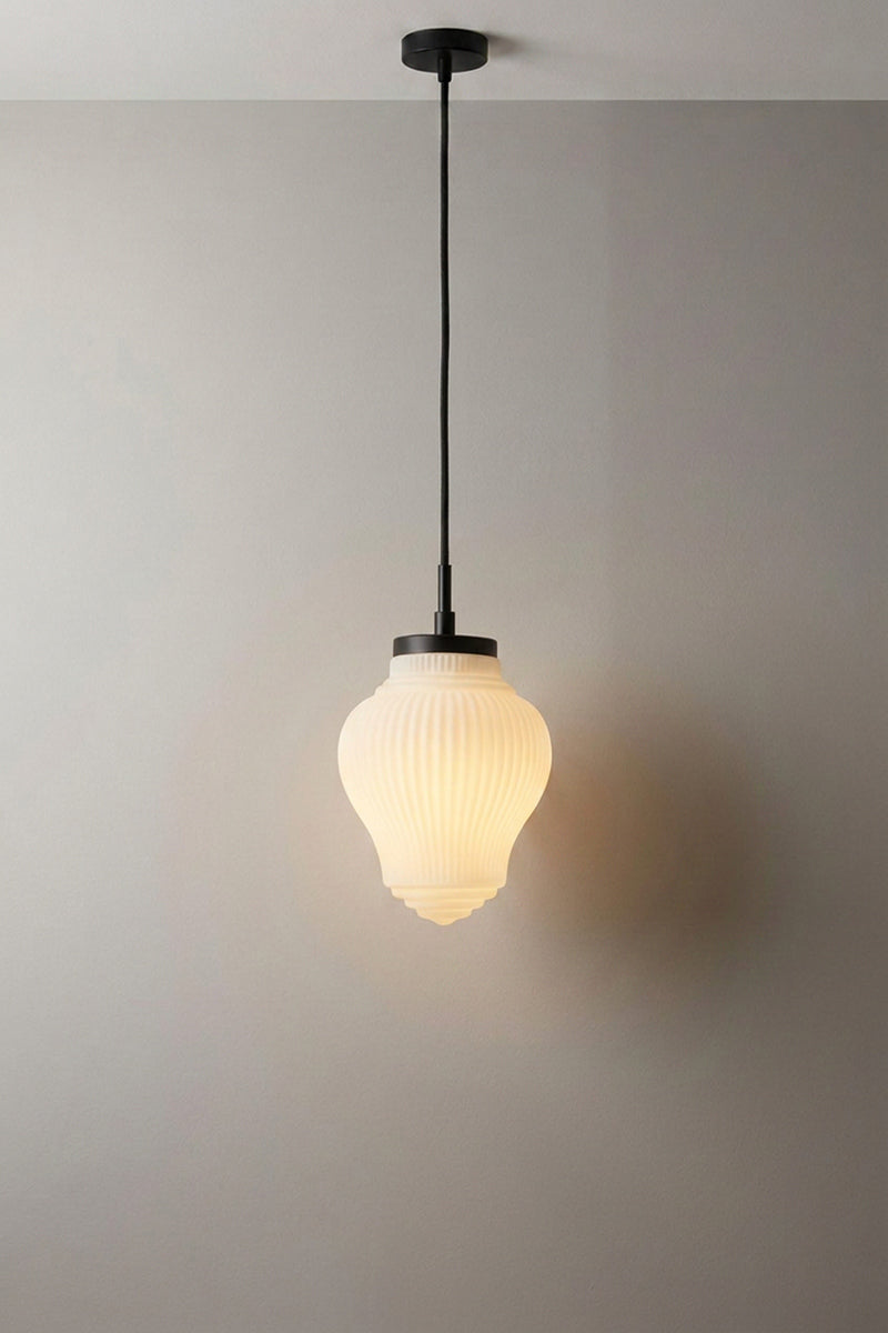 Made from opaque white glass and matt black metal hardware.