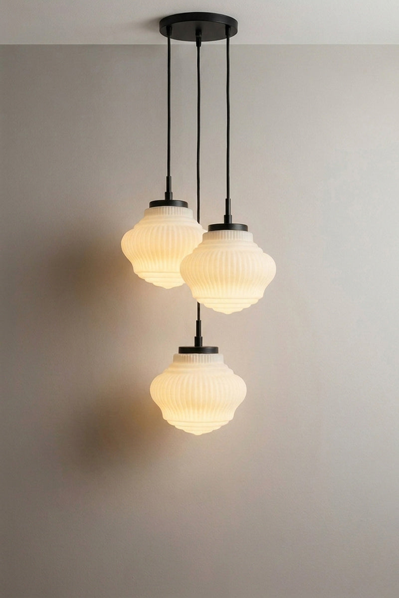 Three-light pendant chandelier with three pendant lights that have opal glass