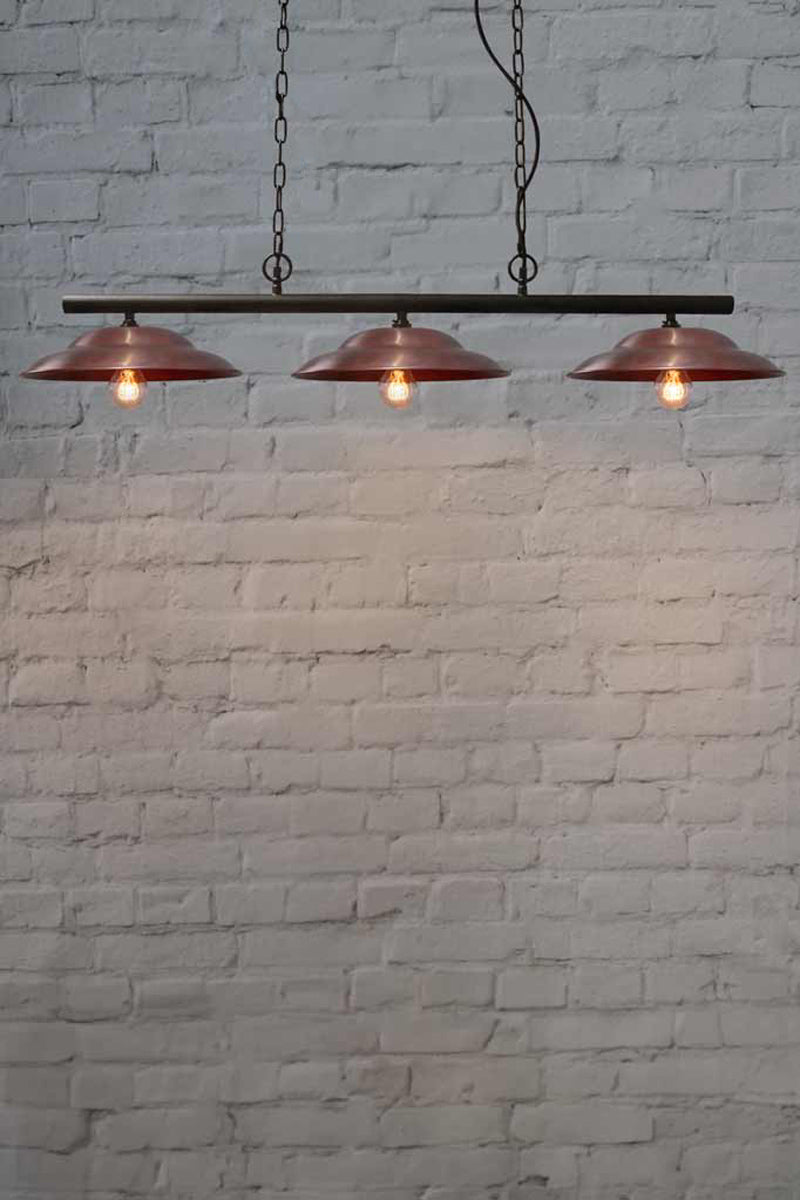 Barn Swing Pendant Light with three copper shades.
