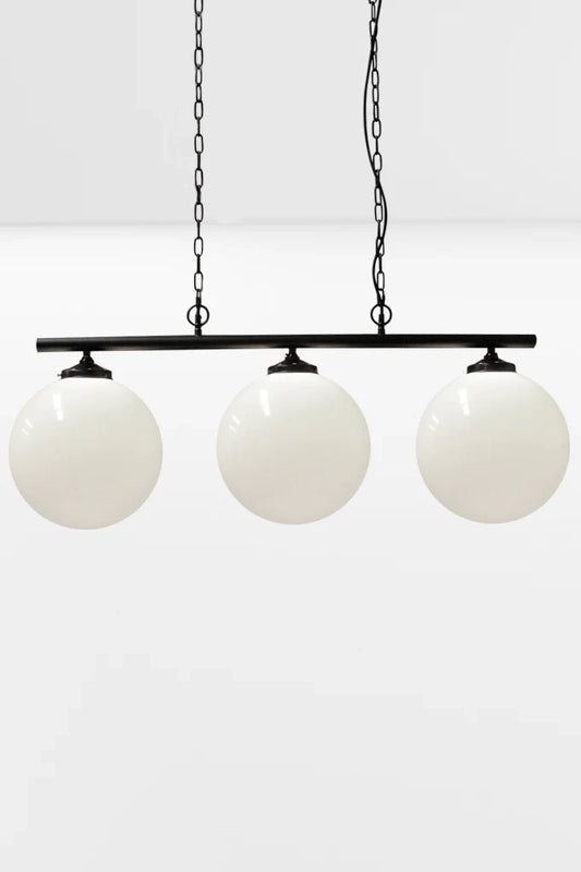 Large opal shades on the 3 light linear bar in black with chain and cloth cord. 