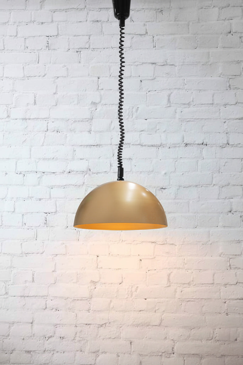 large gold shade on rise and fall cord pendant