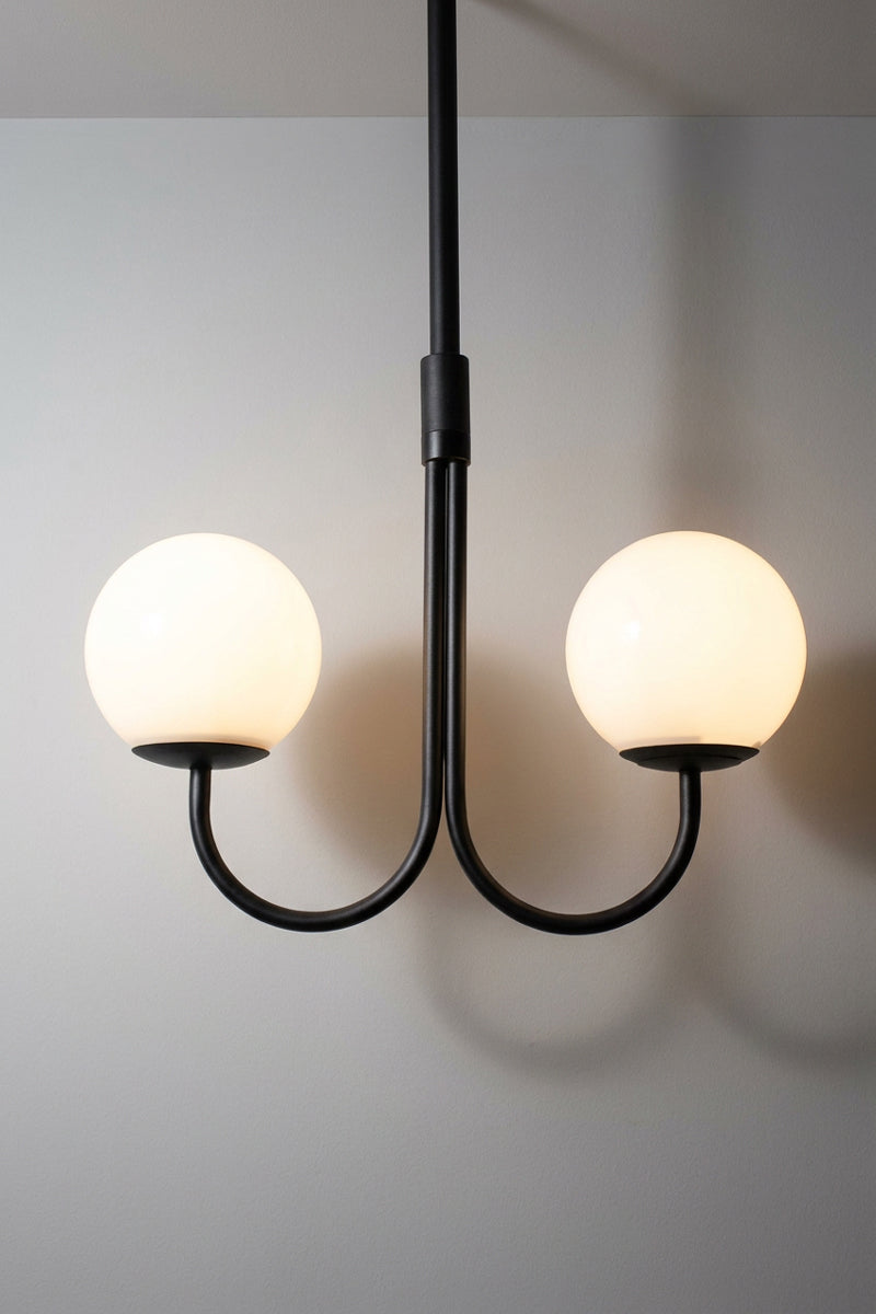 Bonnie Glass Double Chandelier with two glowing opal glass globes, black metal frame and central suspension rod