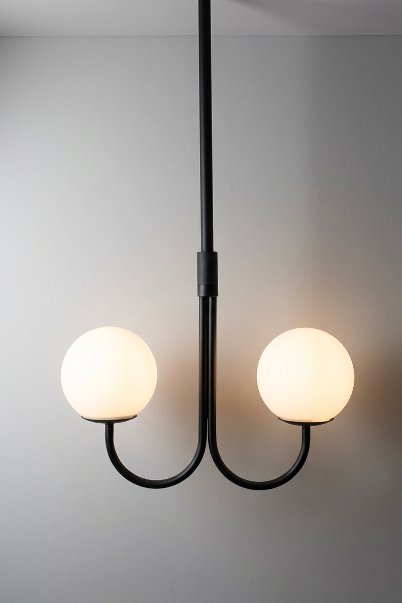 Bonnie Glass Double Chandelier in black with two illuminated opal glass globes and curved metal arms
