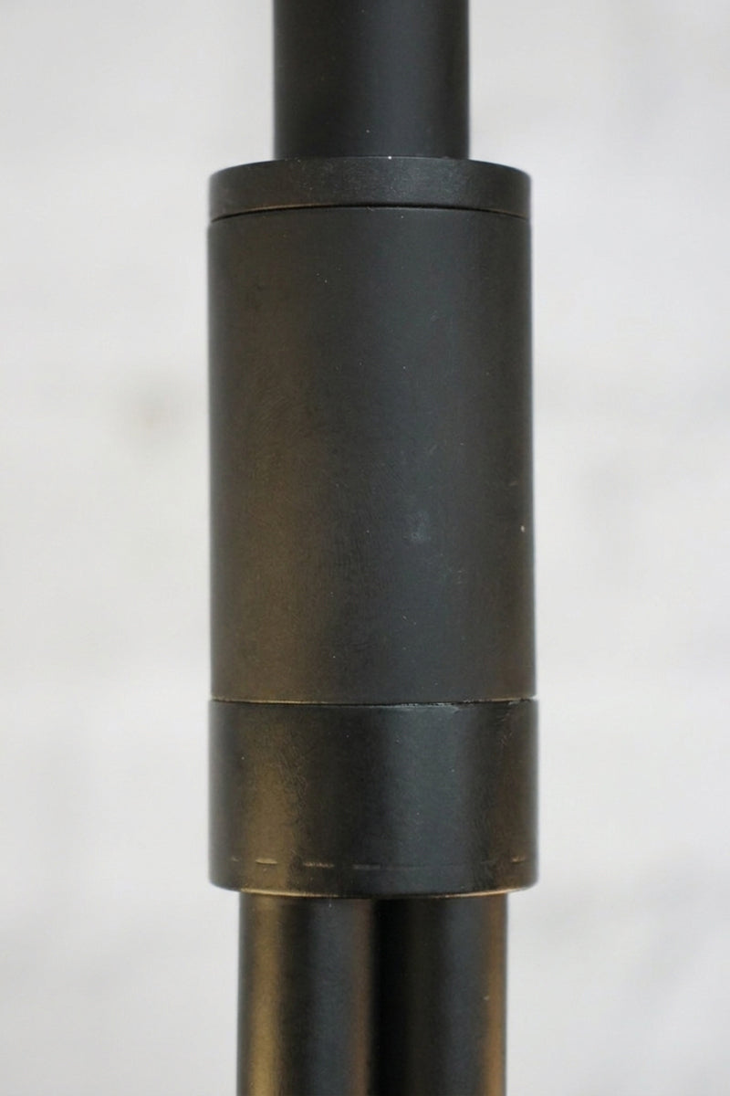 Close-up of the black metal suspension rod and connecting joint on the Bonnie Glass Double Chandelier