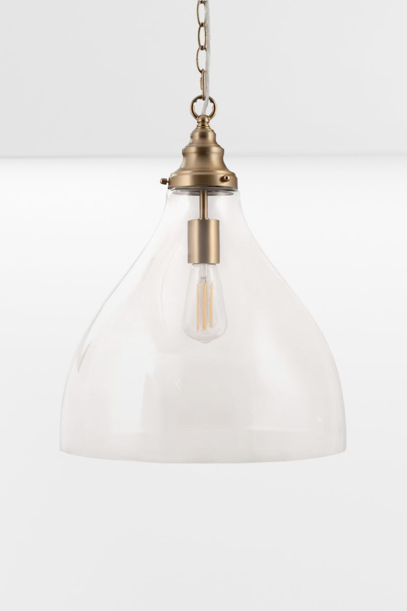 Large clear glass pendant with satin brass metalware. 