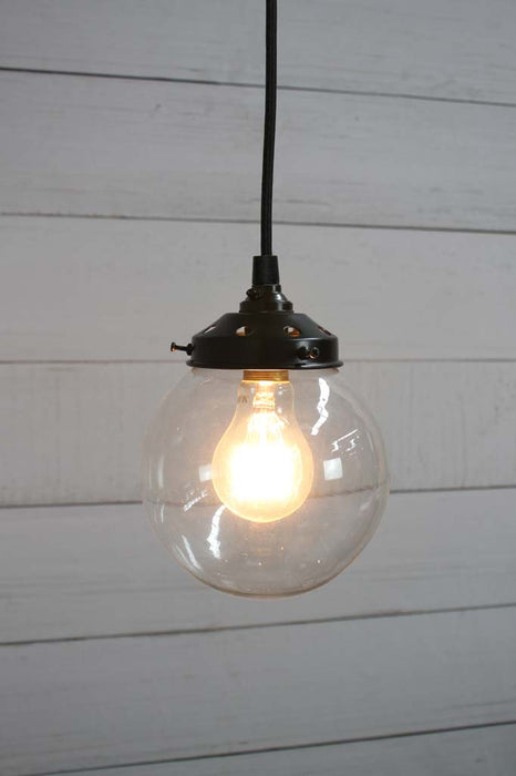Black round cord pendant light with small clear shade