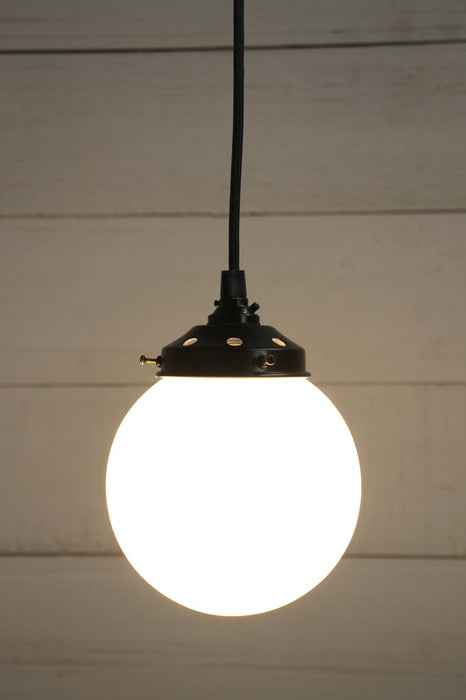 Black round cord pendant light with small opal shade