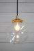 Gold brass round cord pendant light with medium clear shade