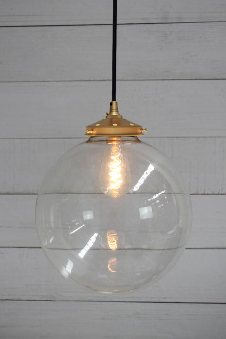 Gold brass round cord pendant light with large clear shade