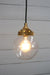 Gold brass round cord pendant light with small clear shade