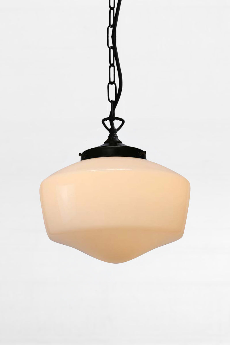 Medium opal glass shade paired with a black gallery and chain and cord suspension. 