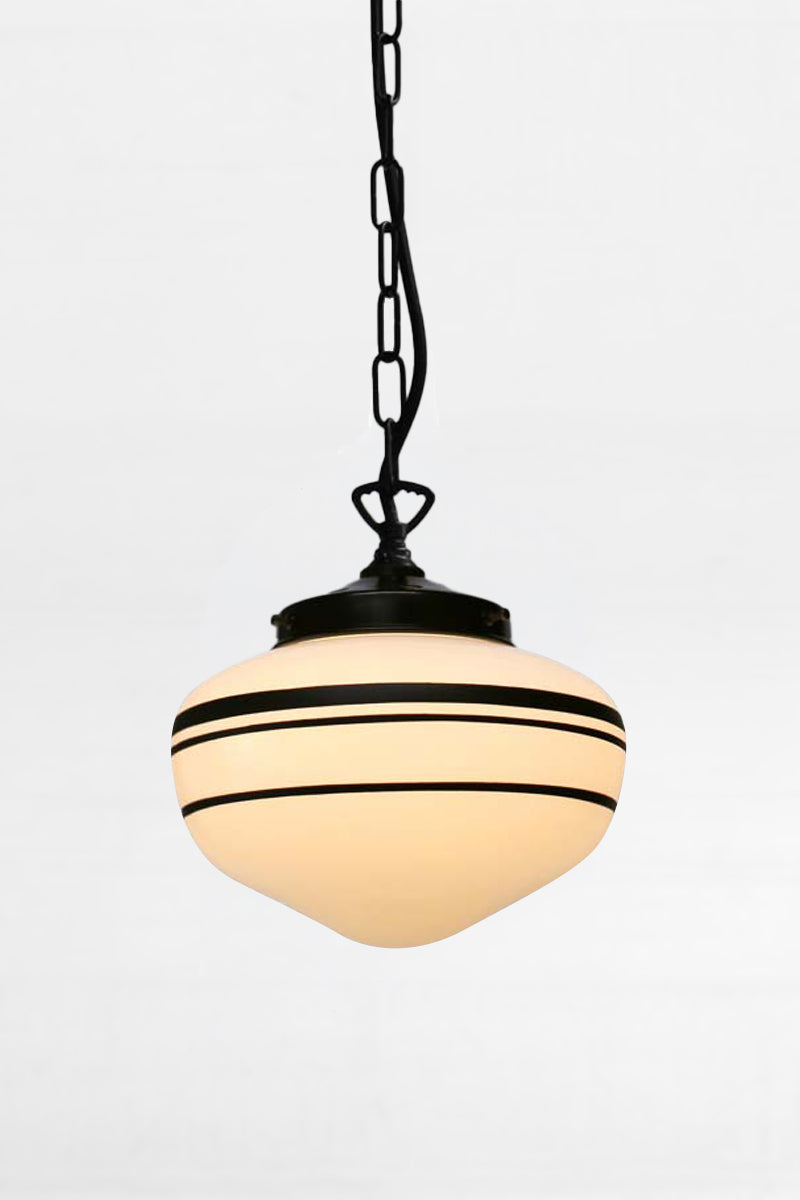 Small opal glass shadw with three hand painted black stripes paired with a saw tooth chain/ cord suspension. 