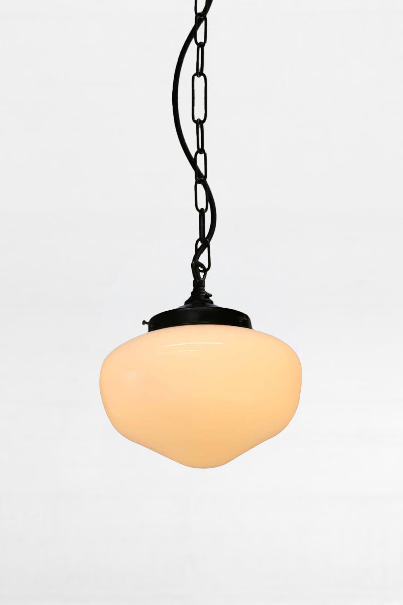Small plain opal glass shade with black chain and cord suspension. 