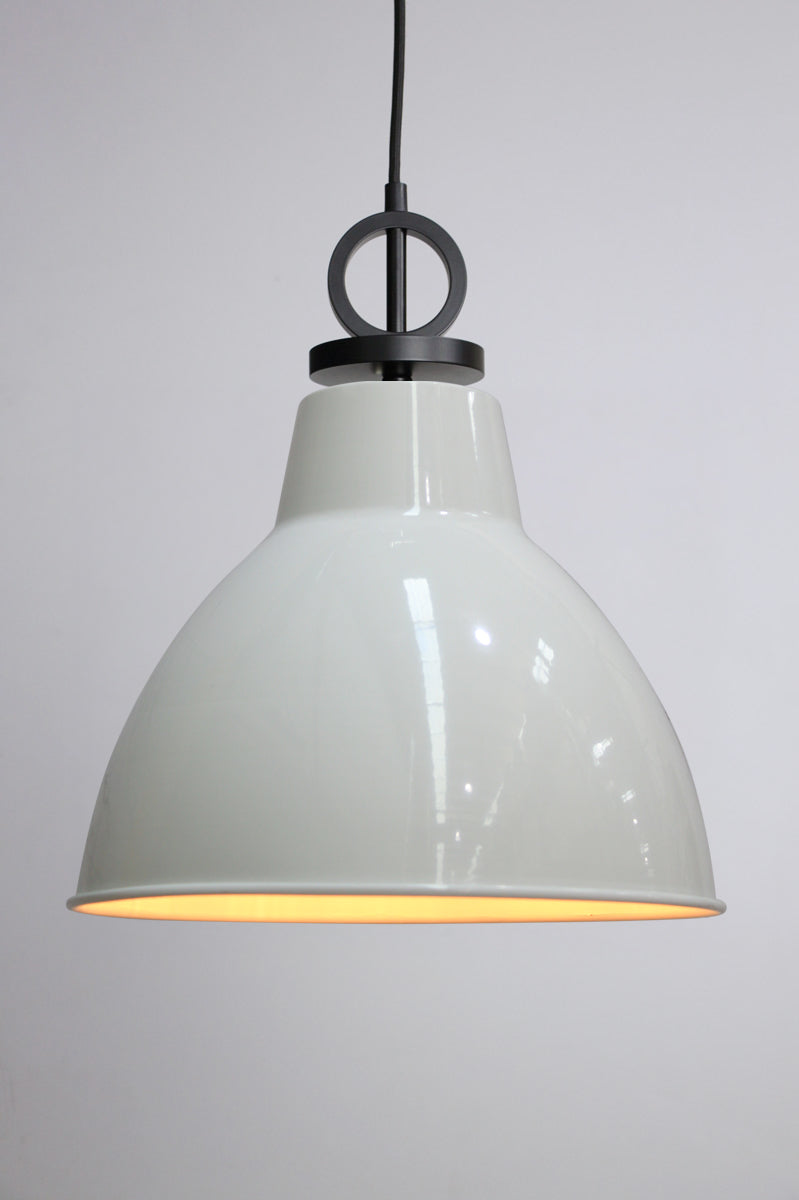 White pendant light with black cord with disc