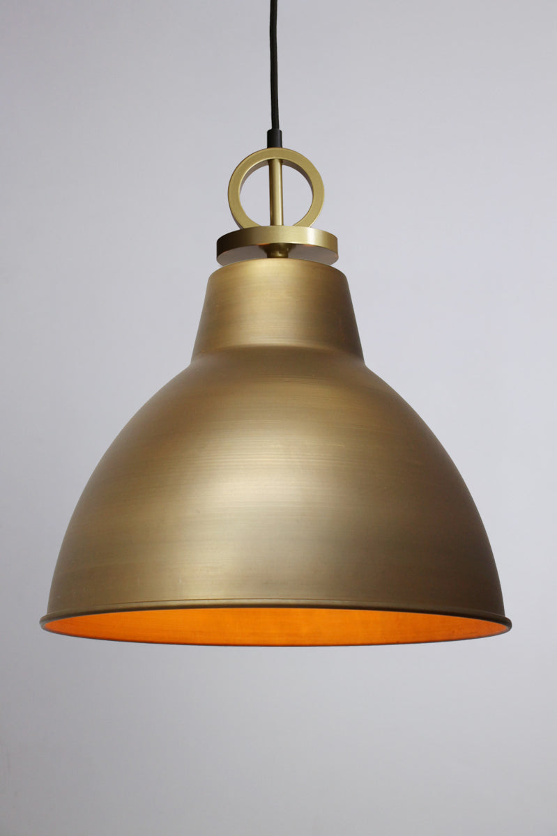 Bright brass pendant light with gold/brass cord with disc