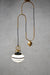 Opal glass three stripe pendant light with gold brass cord and disc
