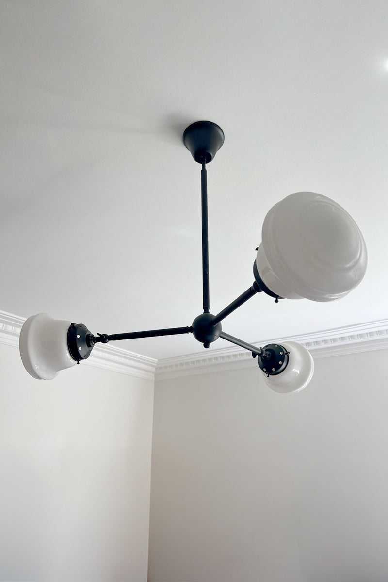 Side angle of Colton Schoolhouse Chandelier mounted to ceiling with opal schoolhouse shades