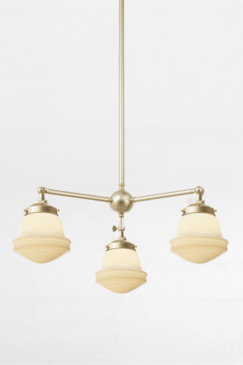 Colton Schoolhouse Chandelier in gold/brass finish with three schoolhouse glass shades