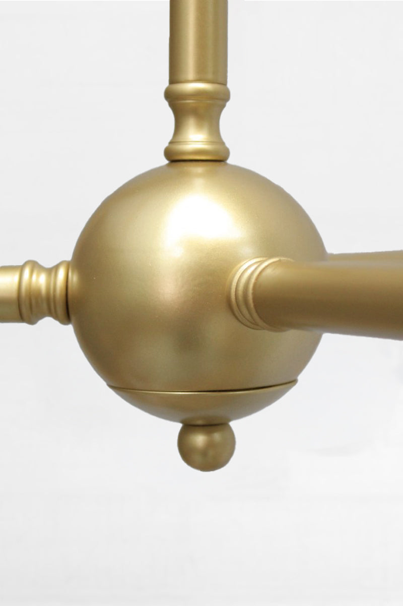 Close up of the centre ball of the gold/brass pendant frame. 
