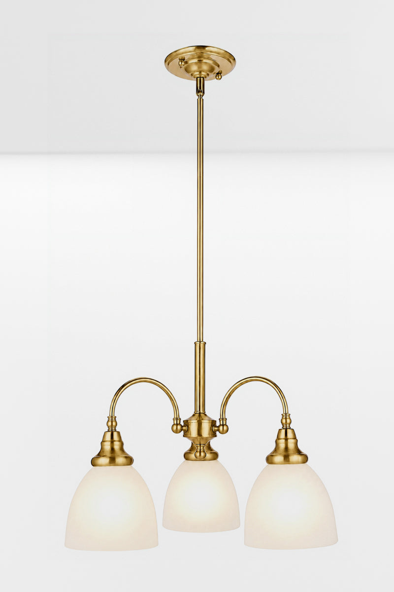 Illuminated Satin Brass 3 light with opal shades facing down. 