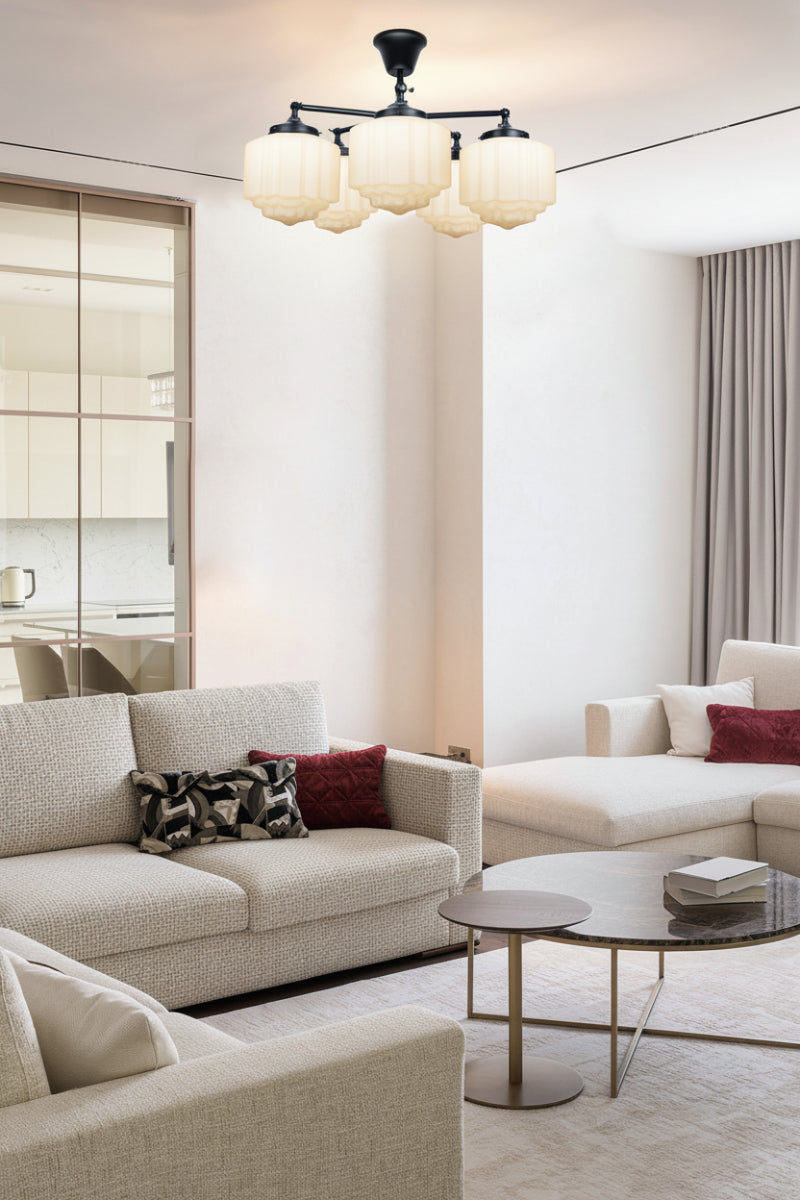 5 light flush mount with opal deco shades in a living room with neutral tones. 
