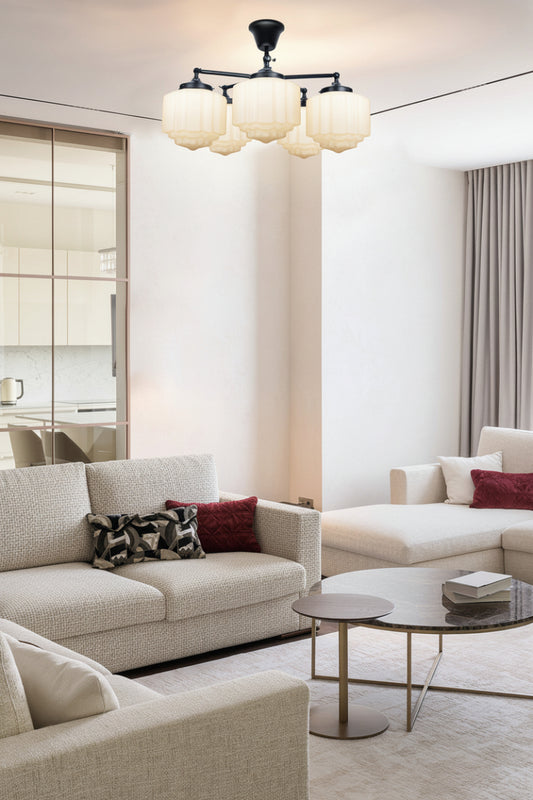 5 light flush mount with opal deco shades in a living room with neutral tones. 