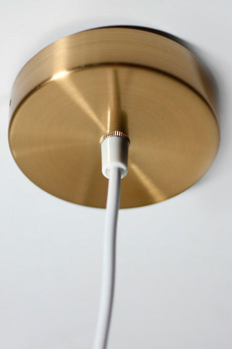 Close-up of the gold ceiling rose of the Menangle pendant light, adding sophistication to the design.