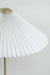 Detailed view of the intricate pleated lampshade