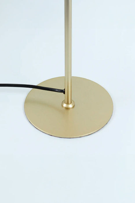 Close-up of the lamp's stylish and gold-finished base