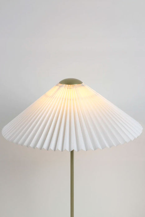 Close-up of the pleated lampshade of the table lamp