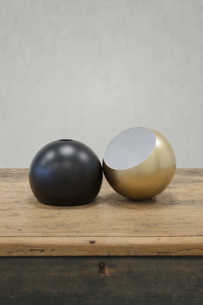 Black and gold/brass bulb shades on a timber bench