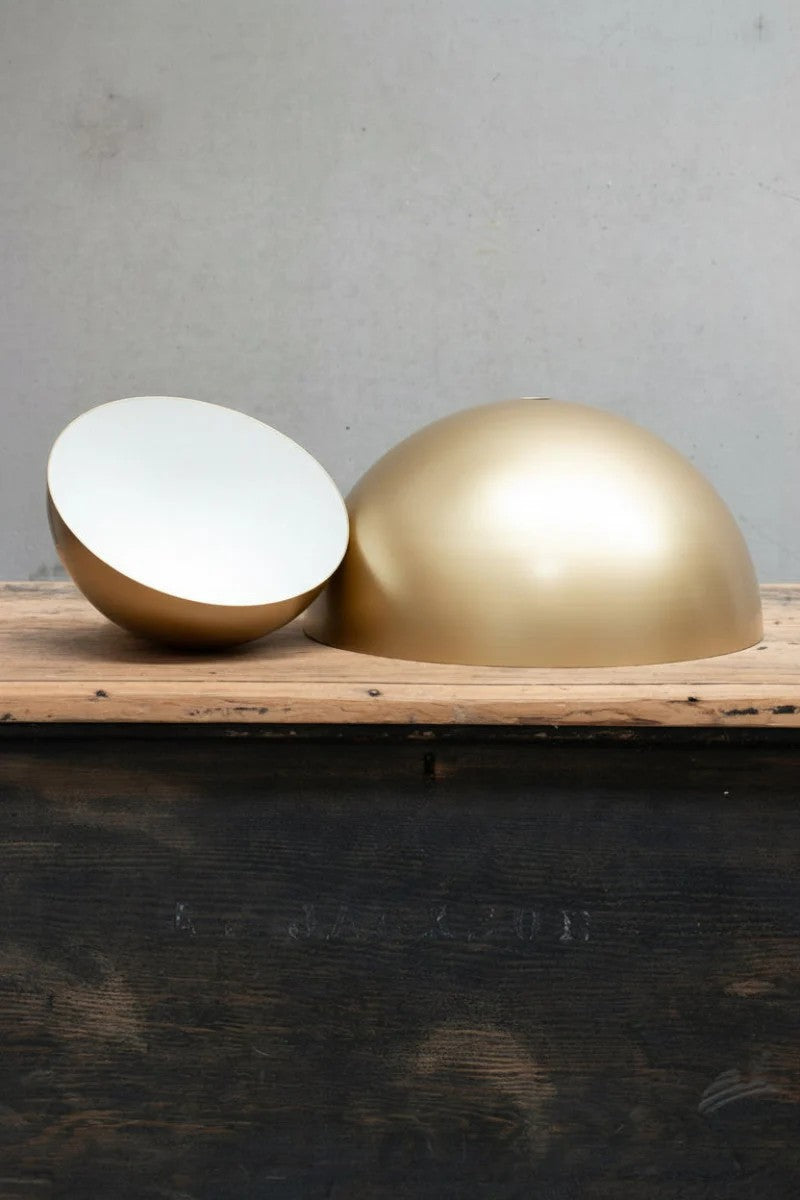 Gold/brass dome shades in small and large.