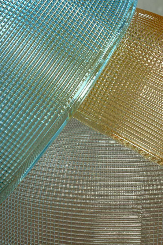 Close up of the holophane glass shades in blue, amber and clear. 