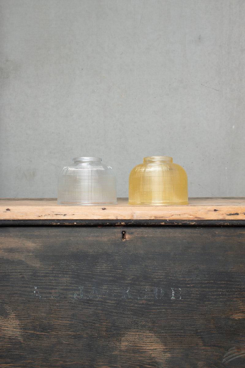 Clear and amber finished small glass crosshatch shades. 