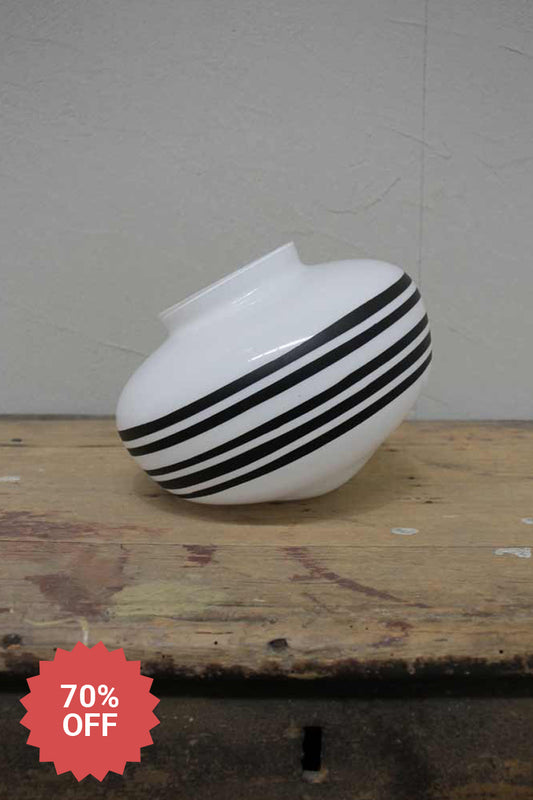 Opal glass schoolhouse style shade with a 5 line painted design. 