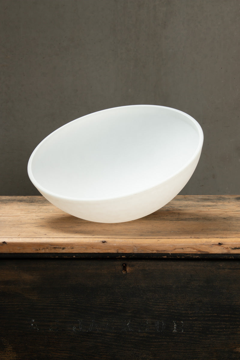 White dome shade for the Homestead Brickworks Pendant Light shown separately on a timber surface