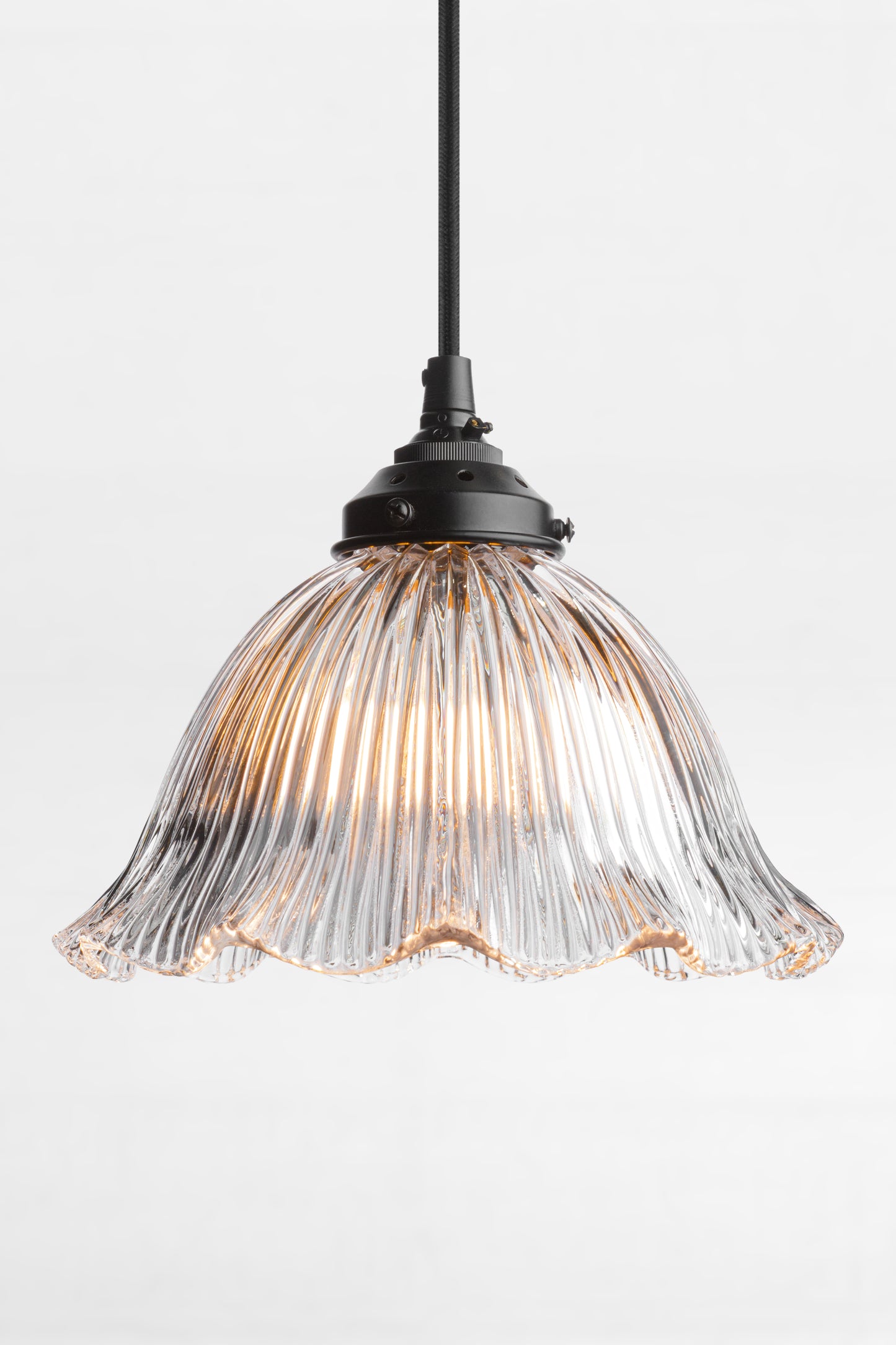 Frill edged clear shade with ribbed detailing and black cord